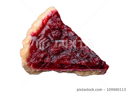 Delicious fragrant sweet pie with cherry berries on a ceramic plate 109980113