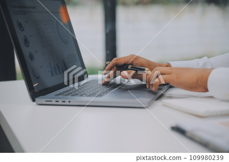 Business people meeting at office writing notes about sticky notes Laptop,tablet Planning and Brainstorming Strategies of Colleagues in office 109980239