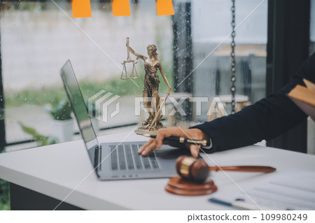 Business and lawyers discussing contract papers with brass scale on desk in office. Law, legal services, advice, justice and law concept picture with film grain effect 109980249