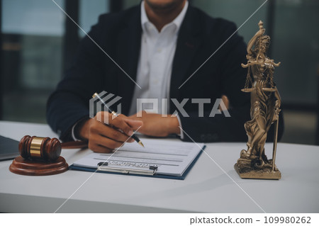 Business and lawyers discussing contract papers with brass scale on desk in office. Law, legal services, advice, justice and law concept picture with film grain effect Business and lawyers discussing contract papers with brass scale on desk in office. Law, legal services, advice, justice and law concept picture with film grain effect 109980262