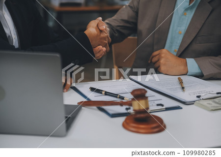 Business and lawyers discussing contract papers with brass scale on desk in office. Law, legal services, advice, justice and law concept picture with film grain effect 109980285