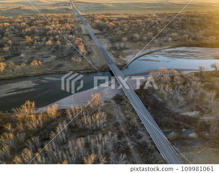 sunset over the South Platte River in eastern Colorado near Crook, aerial view of late November scenery sunset over the South Platte River in eastern Colorado near Crook, aerial view of late November scenery 109981061