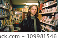 Vintage teenager in a video store. DVD rental case for sale. Video store renting movies in the 80s,90s retro photo 109981546