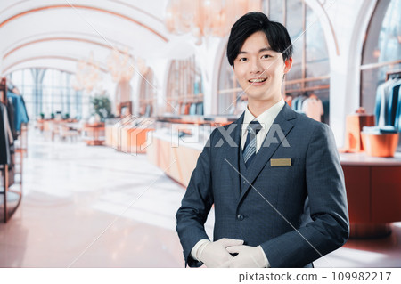 Male staff serving customers at a luxury brand store 109982217