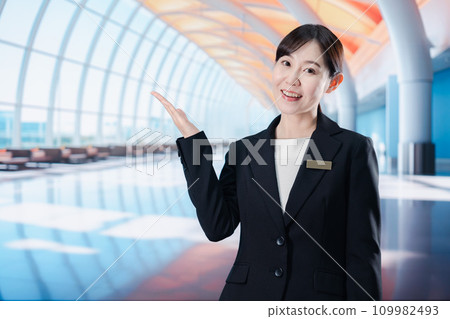 Staff providing guidance at the airport terminal Staff providing guidance at the airport terminal 109982493