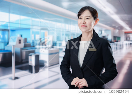 Staff providing guidance at the airport terminal Staff providing guidance at the airport terminal 109982494