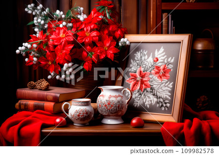 A framed embroidered christmas card with ornaments and candles on wooden table. Winter background with pine twigs A framed embroidered christmas card with ornaments and candles on wooden table. Winter background with pine twigs 109982578