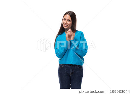 pretty young brunette woman dressed in a blue v-neck cardigan 109983044