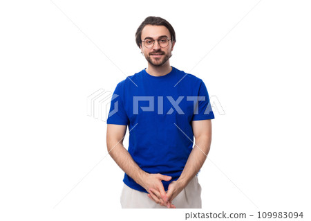 young confident brunette man with a beard dressed in a blue t-shirt on a studio white background young confident brunette man with a beard dressed in a blue t-shirt on a studio white background 109983094