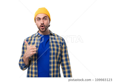 a young brutal brunette man with a beard and mustache in a shirt and cap shows class 109983123
