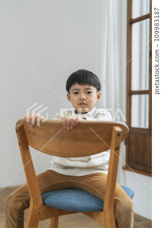 Portrait of a 1st grade elementary school boy smiling looking at the camera 109983187