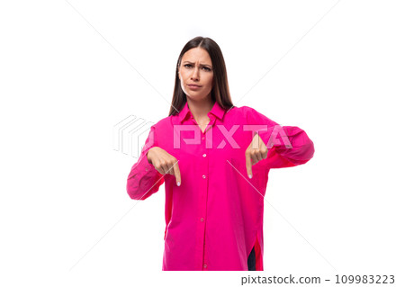 a smart caucasian woman with black straight hair is dressed in a crimson shirt with her index finger a smart caucasian woman with black straight hair is dressed in a crimson shirt with her index finger 109983223