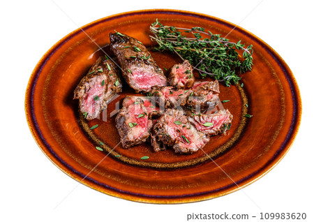 Sliced Grilled barbecue brisket steaks slices on a rustic plate. Isolated on white background, top view. Sliced Grilled barbecue brisket steaks slices on a rustic plate. Isolated on white background, top view. 109983620