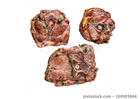 Fried lamb neck meat steaks in a wooden plate with herbs. Isolated on white background, top view. Fried lamb neck meat steaks in a wooden plate with herbs. Isolated on white background, top view. 109983664