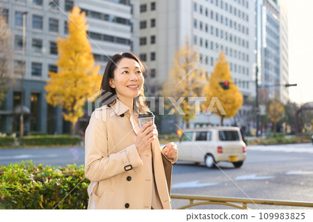 A woman walking in the city A woman walking in the city 109983825