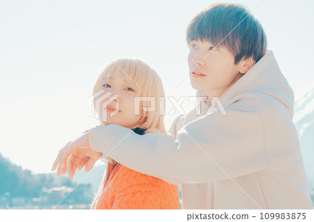 A couple looking at the lake A couple looking at the lake 109983875