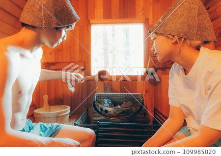 Men and women entering the sauna Men and women entering the sauna 109985020