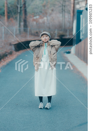 Woman walking in winter street Woman walking in winter street 109985283