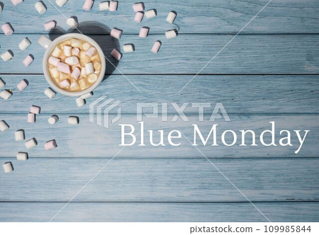 BLUE MONDAY concept text with white cup of coffee and marshmallows on wooden background. The most depressing day of the year in January. Day commit suicide and depression BLUE MONDAY concept text with white cup of coffee and marshmallows on wooden background. The most depressing day of the year in January. Day commit suicide and depression 109985844