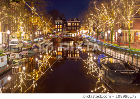 Amsterdam canal with dutch houses 109986172
