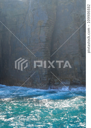 The impressive appearance of the large byobu rock on Iki Tatsunoshima Island washed by the waves The impressive appearance of the large byobu rock on Iki Tatsunoshima Island washed by the waves 109986882