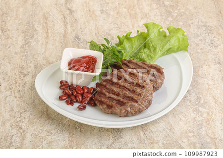 Grilled beef burger cutlet with sauce Grilled beef burger cutlet with sauce 109987923