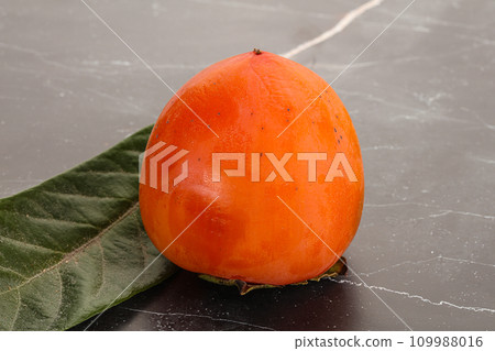 Fresh ripe sweet juicy persimmon Fresh ripe sweet juicy persimmon 109988016