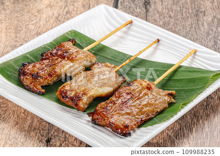 Thai cuisine - grilled pork skewer Thai cuisine - grilled pork skewer 109988235