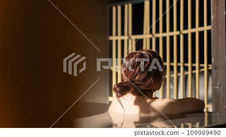 A woman taking an open-air bath A woman taking an open-air bath 109989490