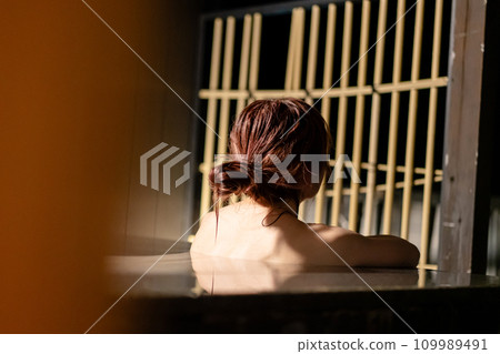 A woman taking an open-air bath A woman taking an open-air bath 109989491