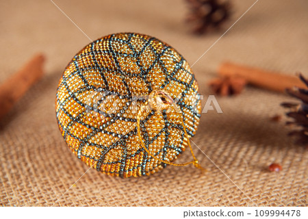 Exquisite handmade Christmas bubble toy from beads, also known as a Christmas globe or Christmas bulb, is a part of holiday decor Exquisite handmade Christmas bubble toy from beads, also known as a Christmas globe or Christmas bulb, is a part of holiday decor 109994478