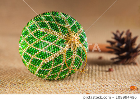 Exquisite handmade Christmas bubble toy from beads, also known as a Christmas globe or Christmas bulb, is a part of holiday decor 109994486