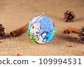 Exquisite handmade Christmas bubble toy from beads, also known as a Christmas globe or Christmas bulb, is a part of holiday decor 109994531