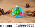 Exquisite handmade Christmas bubble toy from beads, also known as a Christmas globe or Christmas bulb, is a part of holiday decor 109994533