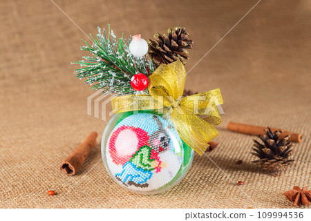 Exquisite handmade Christmas bubble toy from beads, also known as a Christmas globe or Christmas bulb, is a part of holiday decor 109994536