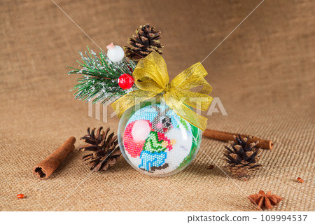 Exquisite handmade Christmas bubble toy from beads, also known as a Christmas globe or Christmas bulb, is a part of holiday decor 109994537