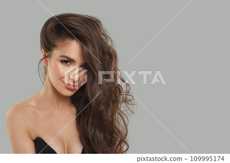 Charming young brunette model woman with long healthy hair, clear fresh skin and makeup Charming young brunette model woman with long healthy hair, clear fresh skin and makeup 109995174