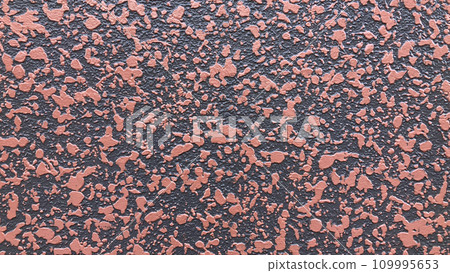 Exterior wall with random red and black patterns 109995653