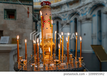 Lighted candles in an Orthodox church Lighted candles in an Orthodox church 109995942