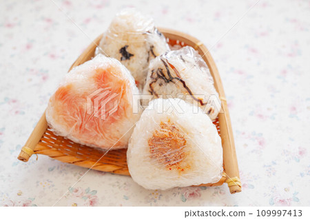 Rice balls wrapped in plastic wrap Rice balls wrapped in plastic wrap 109997413