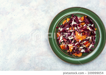 Salad with orange and red organic radicchio. Salad with orange and red organic radicchio. 109999054