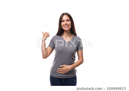 young brunette lady dressed in a gray basic t-shirt with a mockup for a logo on a white background young brunette lady dressed in a gray basic t-shirt with a mockup for a logo on a white background 109999923