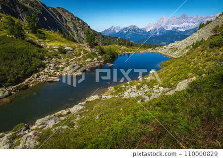 Amazing mountain lake and high snowy peaks in Austria Amazing mountain lake and high snowy peaks in Austria 110000829