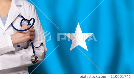 Somali medicine and healthcare concept. Doctor close up against flag of Somalia background 110001745