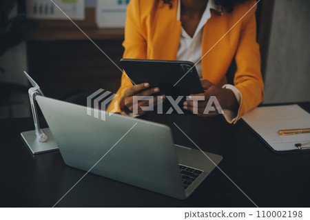 Creative Asian young woman working on laptop in her studio 110002198