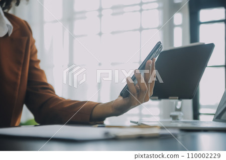 Creative Asian young woman working on laptop in her studio 110002229