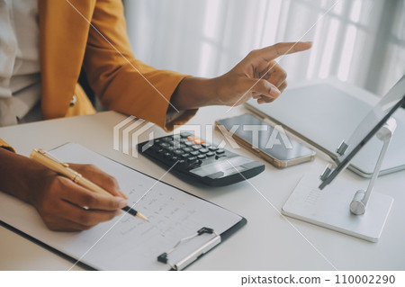 Startup SME small business entrepreneur of freelance Asian woman using a laptop with box Cheerful success happy Asian woman her hand lifts up online marketing packaging and delivery SME idea concept 110002290