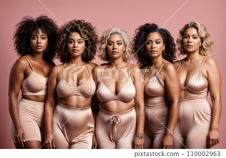 In a harmonious display of body positivity, a group of women confidently pose together wearing lingerie in various shades. They represent diverse body types and skin tones. 110002963