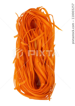 Homemade egg pasta tagliatelle with the addition of carrot. Homemade egg pasta tagliatelle with the addition of carrot. 110003257