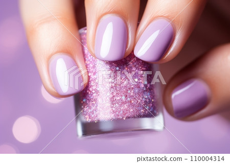 A glittery or sparkly nail polish, against a light pastel background, with a sense of glamour and luxury. The image should convey a sense of celebration and festivity. 110004314